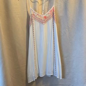 Cream colored, mini dress T-back design